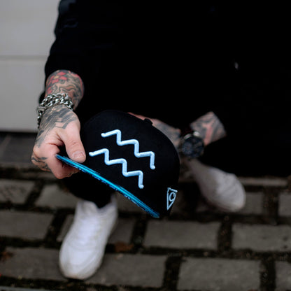 Aquarius Black Snapback Hat with Blue Metallic Brim Zodiac Sign from Capiche Caps