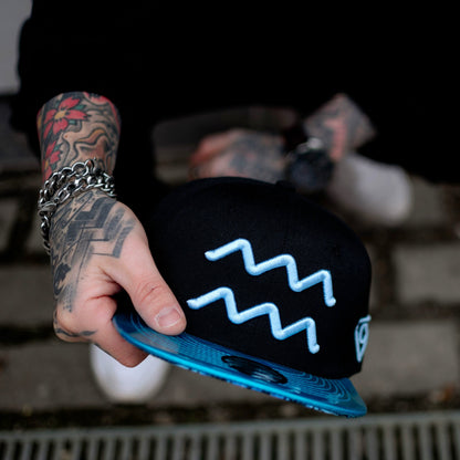 Aquarius Black Snapback Hat with Blue Metallic Brim Zodiac Sign from Capiche Caps