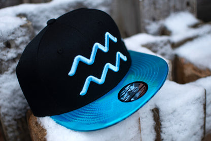 Aquarius Black Snapback Hat with Blue Metallic Brim Zodiac Sign from Capiche Caps