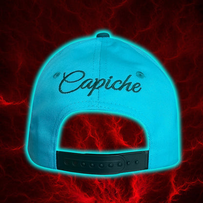 Back view of a blue curved baseball cap with the company's name Capiche embroidered at the back  