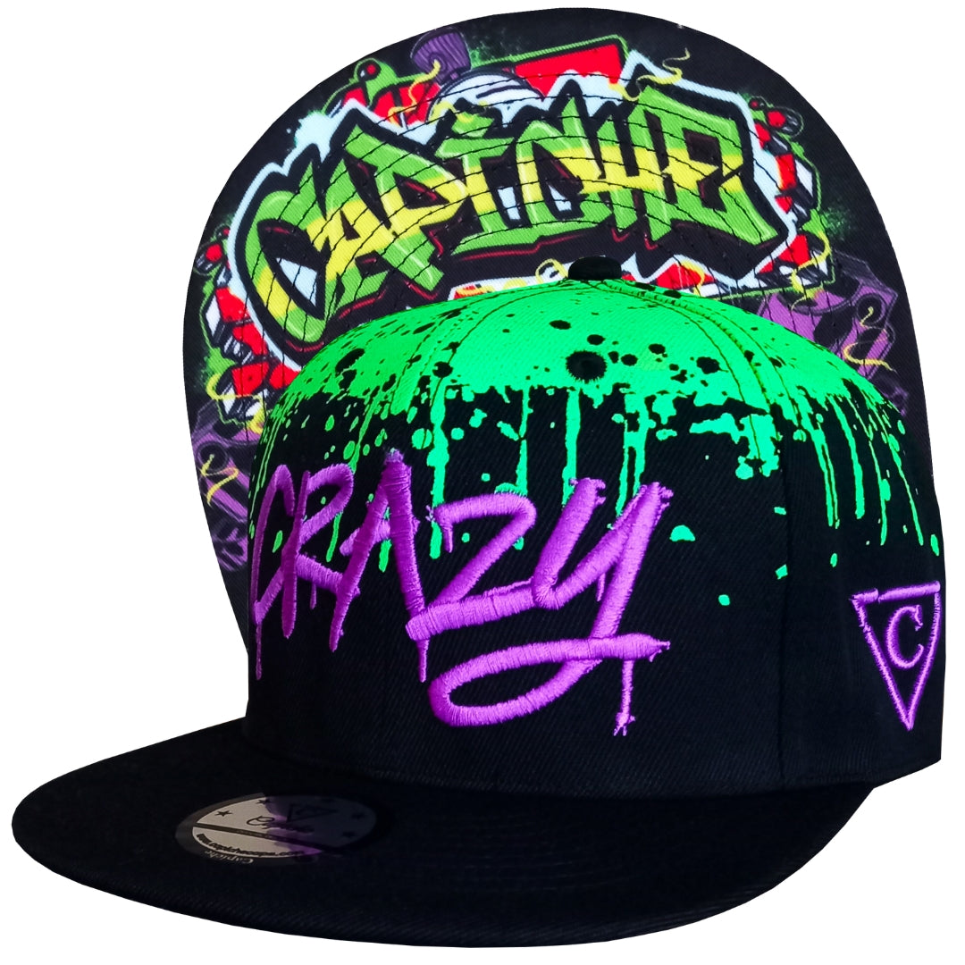 Black snapback hat with green graffiti spray at the top, the snapback is called Freestyler and is from the high-end headwear brand Capiche