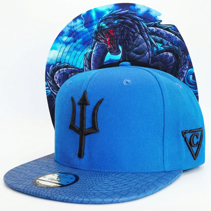 Gorra Snapback Basilisk - Azul y cuero artificial